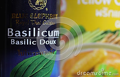 Close up of can thai basilicum with blurred yellow curry box Background Editorial Stock Photo