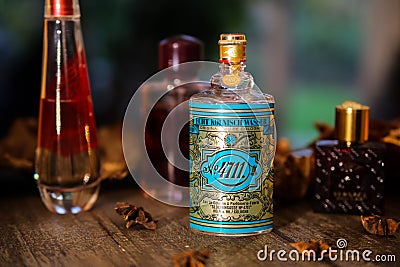 Close up of isolated classic original eau de cologne 4711 bottle on wood table Editorial Stock Photo