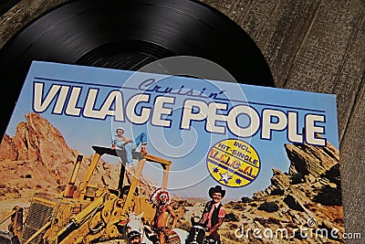 Close up of vintage vinyl record cover of disco band Village people with hit YMCA focus on center Editorial Stock Photo