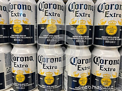 View on stacked mexican corona beer cans in shelf of german supermarket focus on cans in center of upper row Editorial Stock Photo