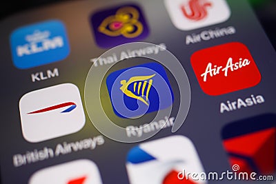 View on variety of international airline booking apps with focus on blue Ryanair logo in center Editorial Stock Photo