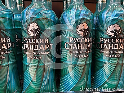 Close up ofgreen russian standard vodka in malachite design bottles in shelf of german supermarket Editorial Stock Photo