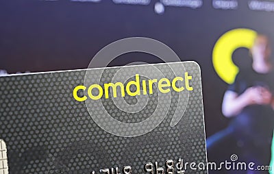 Closeup of on single comdirect banking card, blurred website background Editorial Stock Photo