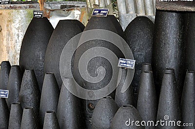 Vietnam - Exploded bombs at Cu Chi tunnels area Stock Photo