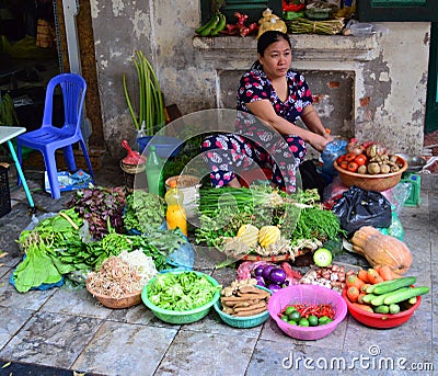 Lady selling fruit and vegetables in Hanoi Vietnam Editorial Stock Photo