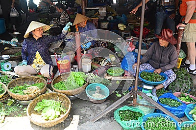 Close up of ladies selling vegetables at market in Hoi An Vietnam Editorial Stock Photo
