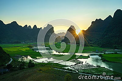 Vietnam landscape with rice field, river, mountain and low clouds in early morning in Trung Khanh, Cao Bang, Vietnam Stock Photo