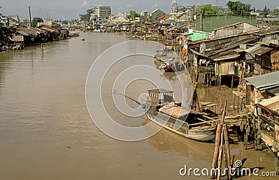 Vietnam: Slums at the dirty side arm of the Mekong River in My T Stock Photo