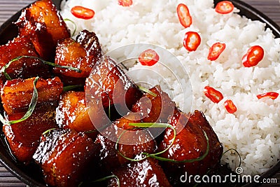 Vietnamese caramel pork with garnish of rice macro on a plate. h Stock Photo