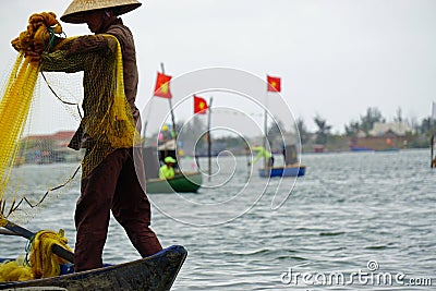 vietnamese fisherman fishing with net Editorial Stock Photo