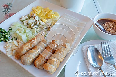 Vietnamese meatball. pork sausage grilled with vegetables and suace Stock Photo