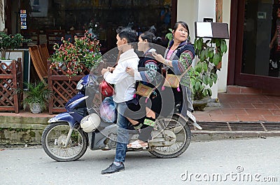 Vietnamese people on motorcycle Editorial Stock Photo