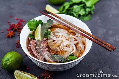 Vietnamese Pho Noodle Soup. Beef with Chilli, Basil, Rice Noodle Stock Photo