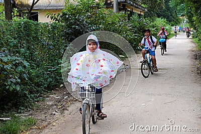 Vietnamese pupil ride bike from school Editorial Stock Photo