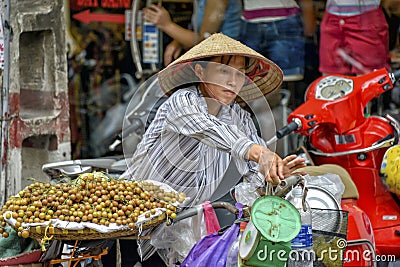 Vietnamese sales woman in Hanoi Editorial Stock Photo