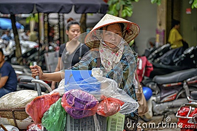 Vietnamese sales woman in Hanoi Editorial Stock Photo