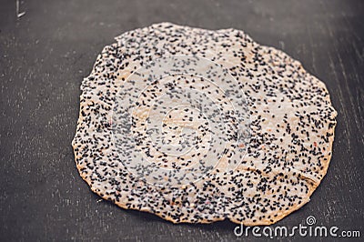 The Vietnamese Sesame Rice Cracker is called Banh Da and is made of tapioca flour, rice flour, salt, and sprinkled with black sesa Stock Photo