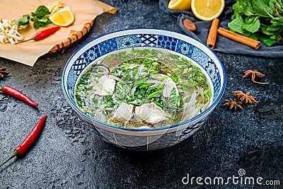 Vietnamese soup Pho GA on black stone table Stock Photo