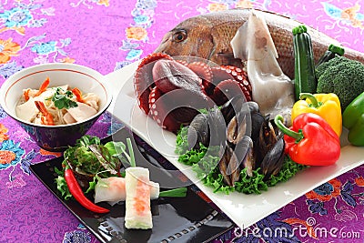 Vietnamese spring vegetables rolls with sea bream, blue mussel, Stock Photo