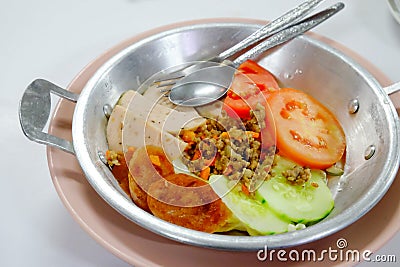 Vietnamese style breakfast, fried egg in pan Stock Photo