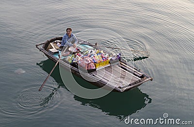 Vietnamese woman in Halong Bay Editorial Stock Photo