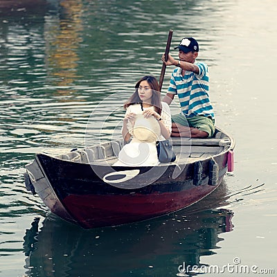 Vietnamese woman in rowboat Editorial Stock Photo