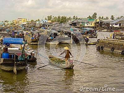 Woman in boat at traditional floating market, Cai Rang Editorial Stock Photo