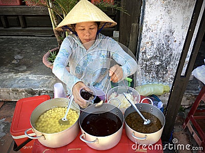 Vietnamese woman seller at Hoi an ancient town, Vietnam Editorial Stock Photo