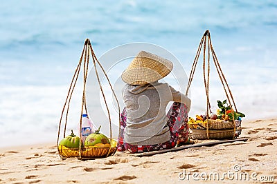Vietnamese woman selling Fruits at Mui Ne beach. Vietnam Editorial Stock Photo