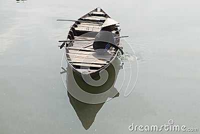 Vietnamese woman on wooden boat. Hoian Vietnam Editorial Stock Photo