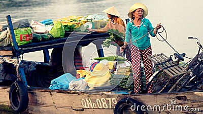 Vietnamese women selling goods in boat Editorial Stock Photo