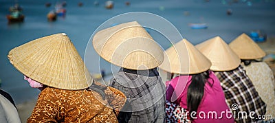 Vietnamese women waiting for fishing boats 3 Editorial Stock Photo