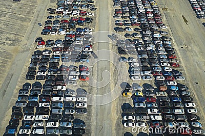 View from above of big parking lot with parked used cars after accident ready for sale. Auction reseller company selling Stock Photo