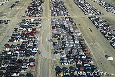 View from above of big parking lot with parked used cars after accident ready for sale. Auction reseller company selling Stock Photo