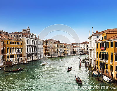 View from above on the Grand Canal, floating gondolas and boats with tourists, Venice Editorial Stock Photo