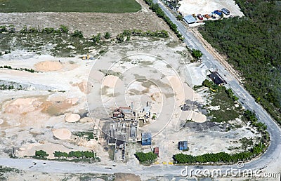 View from above. A huge construction site where sand, clay, crushed stone are stored. Cars Stock Photo