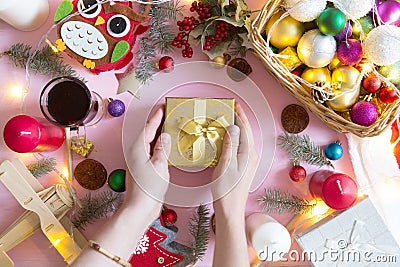 View from above on man holding gift on the Christmas decotated wooden table Stock Photo