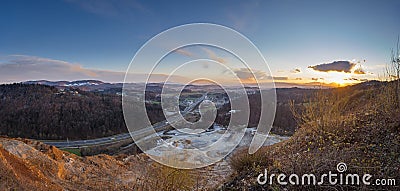 View from above the quarry in Lukovica, looking towards the ljubljana basin with Domzale in the far background. Late evening Stock Photo