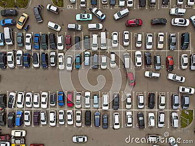 A view from above to the lines of parked cars. Heavy traffic in the parking lot. Searching for spaces in the busy car park. Editorial Stock Photo