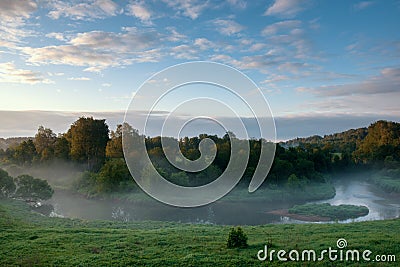 View from above to the small rural river at sunrise Stock Photo