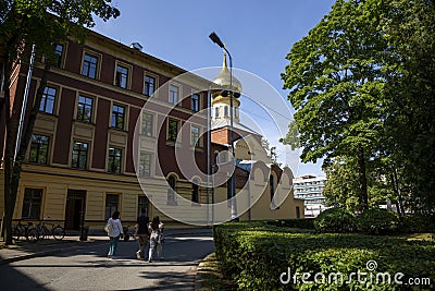 View of the academic building and the church on the territory of Peter the Great St. Petersburg Polytechnic University Editorial Stock Photo