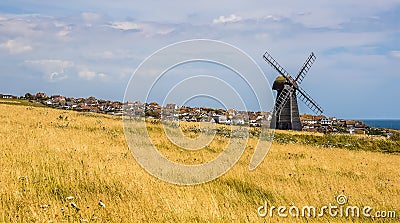 A view across Beacon Hill towards the town of Rottingdean, Sussex, UK Stock Photo