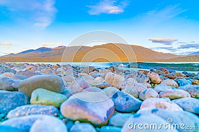 View across Lake Te ANau to Murchison Mountains just before sunrise Stock Photo