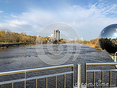 A view from the Adawe Crossing bridge of the Rideau river running through Ottawa on a nice autumn day in Ottawa, Ontario, Canada. Stock Photo