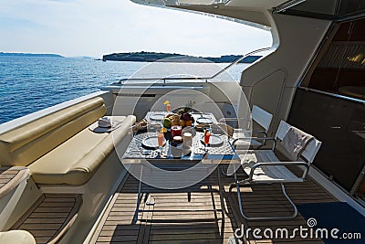 Aft-deck of a motor-yacht in the morning light Stock Photo