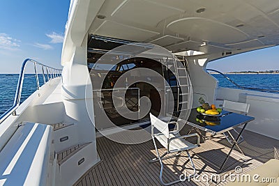 Aft-deck of a motor-yacht in the morning light Stock Photo