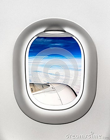 View of aircraft turbine and clouds from airplane window Stock Photo