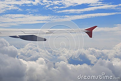 View from airplane illumination above the clouds. Wing of plane. Concept of dreams, transport, eternity, hope, freedom Stock Photo