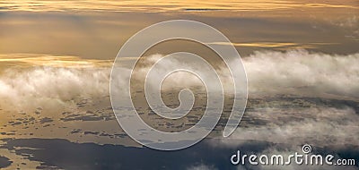 The view from an airplane. Sunrise early morning. Stock Photo