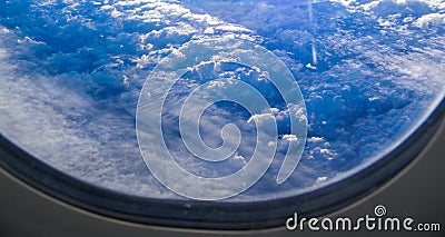 View from airplane window on clouds Stock Photo